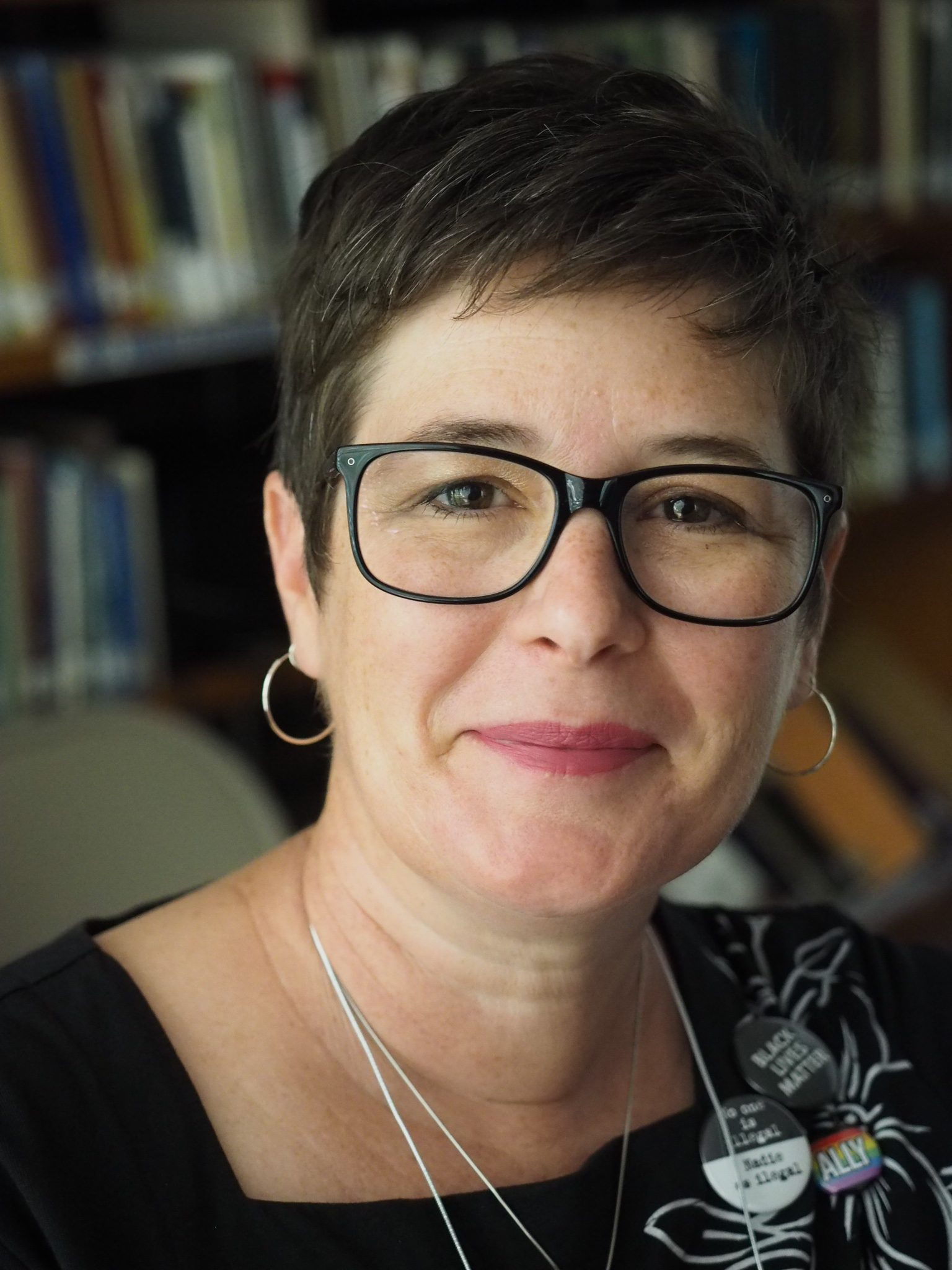 Reverend Rebecca Gant, a lady with short, dark hair and dark-framed glasses